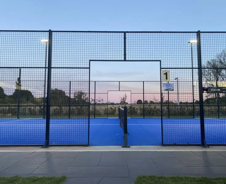 Outdoor panoramic padel court at dusk