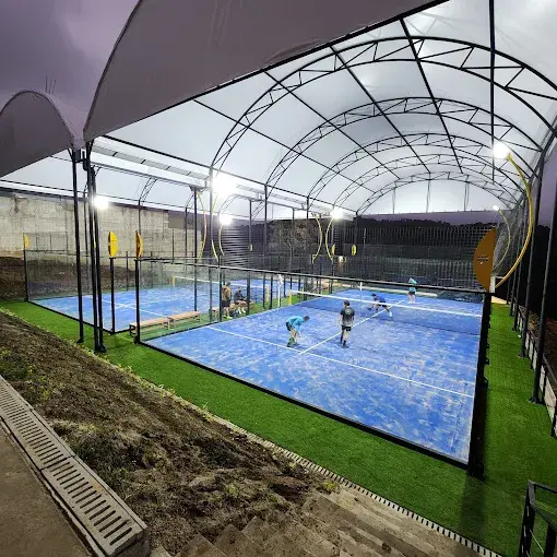 Covered SPORTENVO padel courts in Guatemala at night